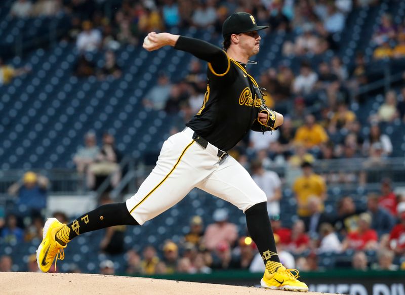 Jun 17, 2024; Pittsburgh, Pennsylvania, USA;  Pittsburgh Pirates starting pitcher Paul Skenes (30) delivers a pitch against the Cincinnati Reds during the first inning at PNC Park. Mandatory Credit: Charles LeClaire-USA TODAY Sports