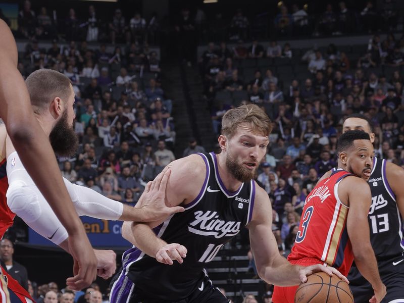 SACRAMENTO, CA - APRIL 11: Domantas Sabonis #10 of the Sacramento Kings dribbles the ball during the game against the New Orleans Pelicans on April 11, 2024 at Golden 1 Center in Sacramento, California. NOTE TO USER: User expressly acknowledges and agrees that, by downloading and or using this Photograph, user is consenting to the terms and conditions of the Getty Images License Agreement. Mandatory Copyright Notice: Copyright 2024 NBAE (Photo by Rocky Widner/NBAE via Getty Images)