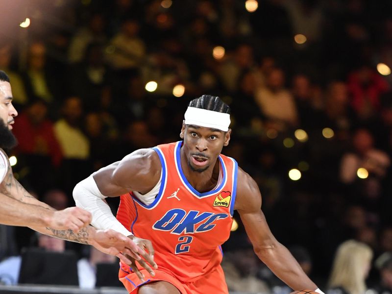 LAS VEGAS, NV - DECEMBER 14: Shai Gilgeous-Alexander #2 of the Oklahoma City Thunder dribbles the ball during the game dribbles the ball during the game against the Houston Rockets during the Emirates NBA Cup Semifinal game on December 14, 2024 at T-Mobile Arena in Las Vegas, Nevada. NOTE TO USER: User expressly acknowledges and agrees that, by downloading and/or using this Photograph, user is consenting to the terms and conditions of the Getty Images License Agreement. Mandatory Copyright Notice: Copyright 2024 NBAE (Photo by Logan Riely/NBAE via Getty Images)