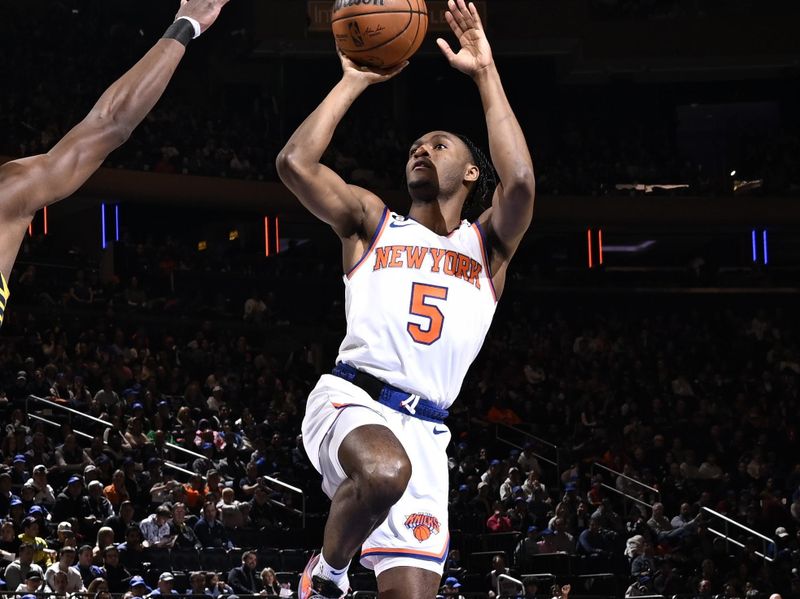 NEW YORK, NY - APRIL 9: Immanuel Quickley #5 of the New York Knicks shoots the ball during the game against the Indiana Pacers on April 9, 2023 at Madison Square Garden in New York City, New York. NOTE TO USER: User expressly acknowledges and agrees that, by downloading and or using this photograph, User is consenting to the terms and conditions of the Getty Images License Agreement. Mandatory Copyright Notice: Copyright 2023 NBAE  (Photo by David Dow/NBAE via Getty Images)