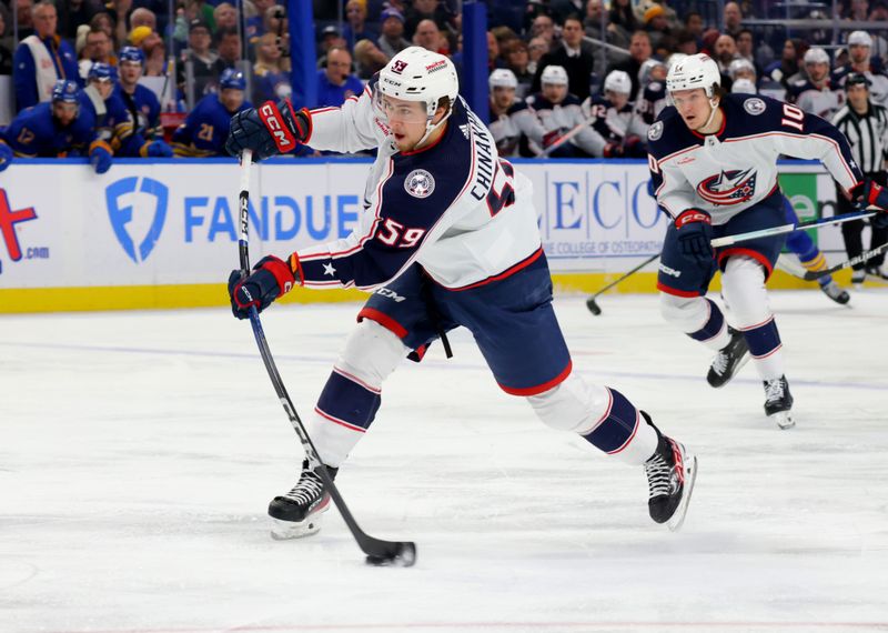 Dec 30, 2023; Buffalo, New York, USA;  Columbus Blue Jackets right wing Yegor Chinakhov (59) takes a shot on goal during the first period against the Buffalo Sabres at KeyBank Center. Mandatory Credit: Timothy T. Ludwig-USA TODAY Sports