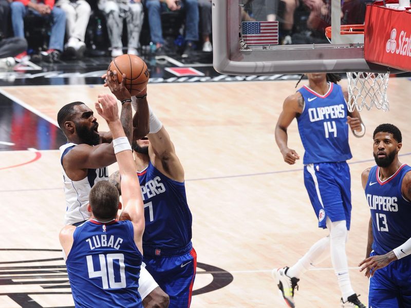 LOS ANGELES, CA - APRIL 21: Tim Hardaway Jr. #10 of the Dallas Mavericks drives to the basket during the game against the LA Clippers during the 2024 NBA Playoffs on April 21, 2024 at Crypto.Com Arena in Los Angeles, California. NOTE TO USER: User expressly acknowledges and agrees that, by downloading and/or using this Photograph, user is consenting to the terms and conditions of the Getty Images License Agreement. Mandatory Copyright Notice: Copyright 2024 NBAE (Photo by Andrew D. Bernstein/NBAE via Getty Images)