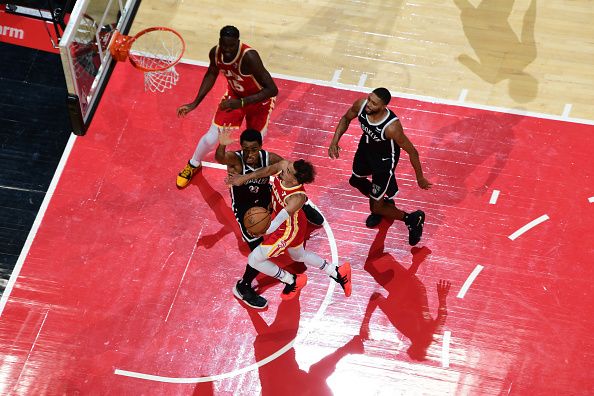 ATLANTA, GA - DECEMBER 6: Trae Young #11 of the Atlanta Hawks drives to the basket during the game against the Brooklyn Nets on December 6, 2023 at State Farm Arena in Atlanta, Georgia.  NOTE TO USER: User expressly acknowledges and agrees that, by downloading and/or using this Photograph, user is consenting to the terms and conditions of the Getty Images License Agreement. Mandatory Copyright Notice: Copyright 2023 NBAE (Photo by Scott Cunningham/NBAE via Getty Images)