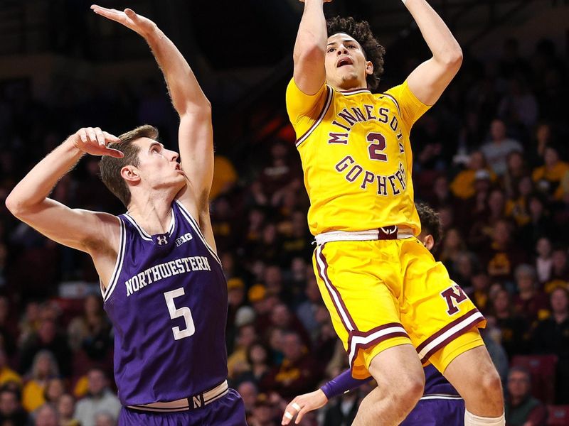 Feb 3, 2024; Minneapolis, Minnesota, USA; Minnesota Golden Gophers guard Mike Mitchell Jr. (2) shoots as Northwestern Wildcats guard Ryan Langborg (5) defends during the first half at Williams Arena. Mandatory Credit: Matt Krohn-USA TODAY Sports