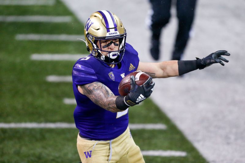 Nov 14, 2020; Seattle, Washington, USA; Washington Huskies running back Sean McGrew (5) rushes for a touchdown against the Oregon State Beavers during the first quarter at Alaska Airlines Field at Husky Stadium. Mandatory Credit: Joe Nicholson-USA TODAY Sports