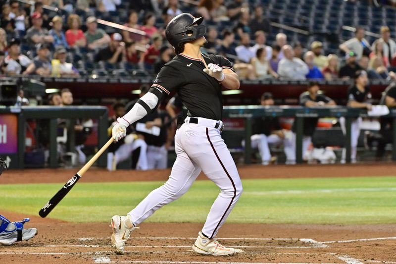 Apr 24, 2023; Phoenix, Arizona, USA; Arizona Diamondbacks center fielder Alek Thomas (5) hits a sacrifice fly in the second inning against the Kansas City Royals at Chase Field. Mandatory Credit: Matt Kartozian-USA TODAY Sports