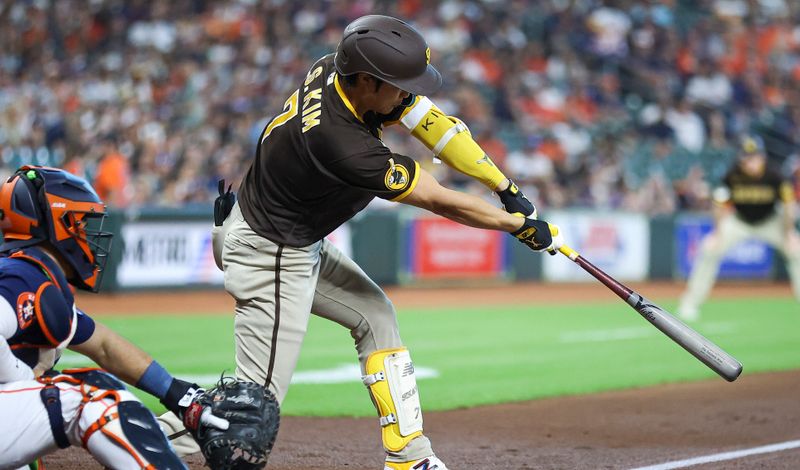 Sep 10, 2023; Houston, Texas, USA; San Diego Padres second baseman Ha-Seong Kim (7) hits a single during the third inning against the Houston Astros at Minute Maid Park. Mandatory Credit: Troy Taormina-USA TODAY Sports