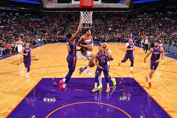 PHOENIX, AZ - DECEMBER 17: Jordan Poole #13 of the Washington Wizards drives to the basket during the game against the Phoenix Suns on December 17, 2023 at Footprint Center in Phoenix, Arizona. NOTE TO USER: User expressly acknowledges and agrees that, by downloading and or using this photograph, user is consenting to the terms and conditions of the Getty Images License Agreement. Mandatory Copyright Notice: Copyright 2023 NBAE (Photo by Barry Gossage/NBAE via Getty Images)