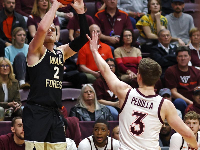 Mar 2, 2024; Blacksburg, Virginia, USA; Wake Forest Demon Deacons guard Cameron Hildreth (2) shoots the ball against Virginia Tech Hokies guard Sean Pedulla (3) during the first half at Cassell Coliseum. Mandatory Credit: Peter Casey-USA TODAY Sports