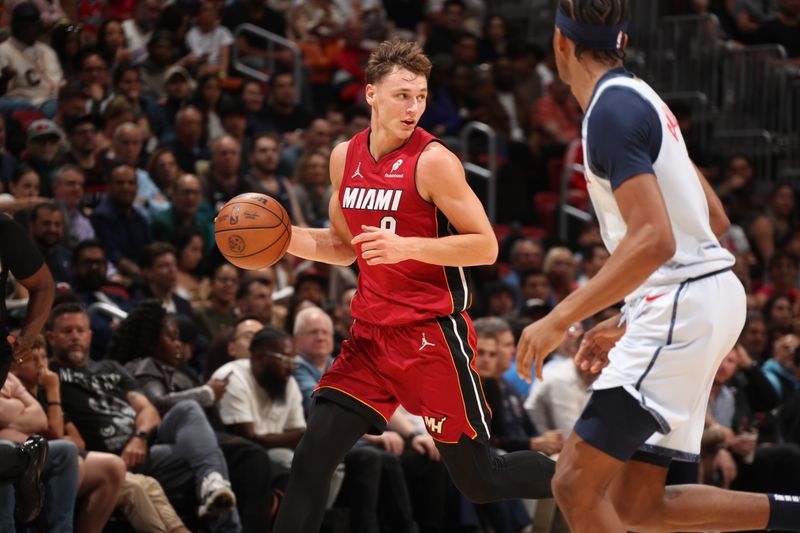 MIAMI, FL - MARCH 3: Pelle Larsson #9 of the Miami Heat dribbles the ball during the game against the Washington Wizards on March 3, 2025 at Kaseya Center in Miami, Florida. NOTE TO USER: User expressly acknowledges and agrees that, by downloading and or using this Photograph, user is consenting to the terms and conditions of the Getty Images License Agreement. Mandatory Copyright Notice: Copyright 2025 NBAE (Photo by Issac Baldizon/NBAE via Getty Images)