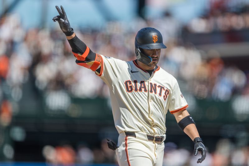 Apr 21, 2024; San Francisco, California, USA;  San Francisco Giants left fielder Michael Conforto (8) gestures after a single against the Arizona Diamondbacks during the seventh inning at Oracle Park. Mandatory Credit: John Hefti-USA TODAY Sports