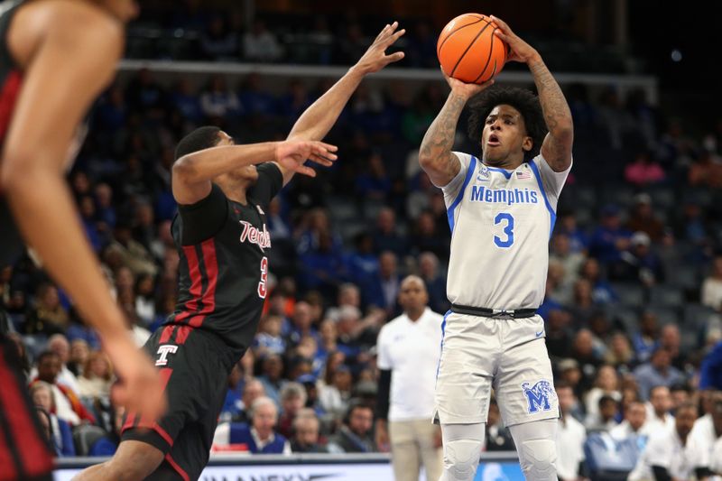 Feb 12, 2023; Memphis, Tennessee, USA; Memphis Tigers guard Kendric Davis (3) shoots for three as Temple Owls guard Hysier Miller (3) defends during the first half at FedExForum. Mandatory Credit: Petre Thomas-USA TODAY Sports