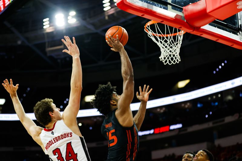 Jan 30, 2024; Raleigh, North Carolina, USA; Miami (Fl) Hurricanes forward Norchad Omier (15) shoots the ball during the second half against North Carolina State Wolfpack at PNC Arena. Mandatory Credit: Jaylynn Nash-USA TODAY Sports