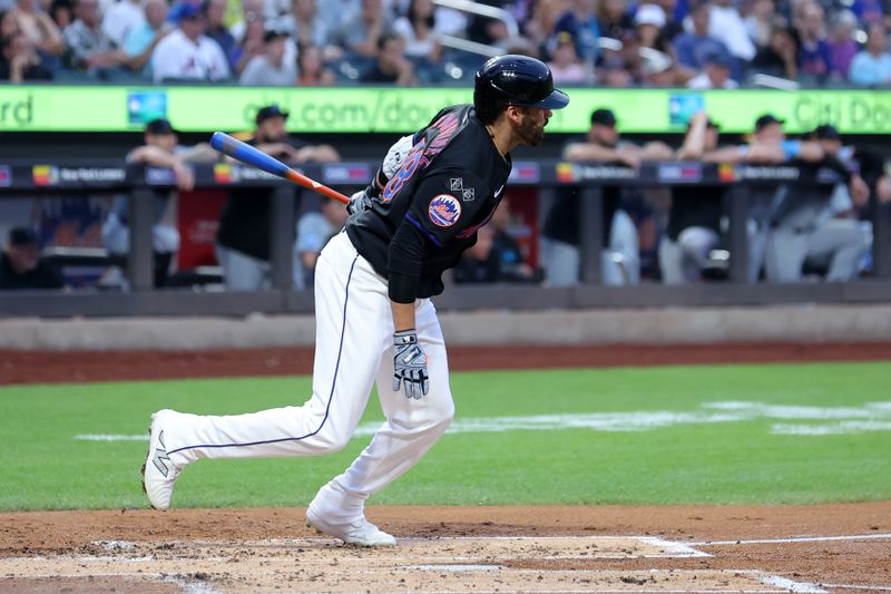 Aug 16, 2024; New York City, New York, USA; New York Mets designated hitter J.D. Martinez (28) follows through on an RBI single against the Miami Marlins during the first inning at Citi Field. Mandatory Credit: Brad Penner-USA TODAY Sports