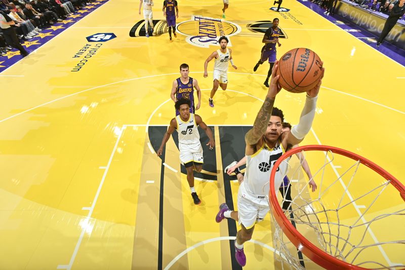 LOS ANGELES, CA - NOVEMBER 19: Keyonte George #3 of the Utah Jazz drives to the basket during the game against the Los Angeles Lakers during the Emirates NBA Cup game on November 19, 2024 at Crypto.Com Arena in Los Angeles, California. NOTE TO USER: User expressly acknowledges and agrees that, by downloading and/or using this Photograph, user is consenting to the terms and conditions of the Getty Images License Agreement. Mandatory Copyright Notice: Copyright 2024 NBAE (Photo by Adam Pantozzi/NBAE via Getty Images)