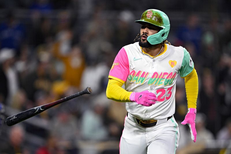 Apr 19, 2024; San Diego, California, USA; San Diego Padres right fielder Fernando Tatis Jr. (23) flips his bat after hitting a home run against the Toronto Blue Jays during the third inning at Petco Park. Mandatory Credit: Orlando Ramirez-USA TODAY Sports 