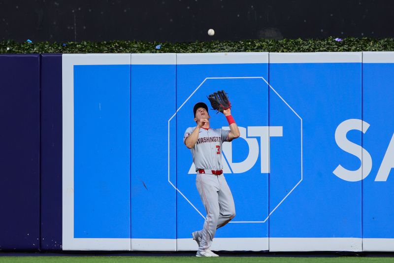 Apr 29, 2024; Miami, Florida, USA; Washington Nationals center fielder Jacob Young (30) catches a fly ball to retire Miami Marlins designated hitter Bryan De La Cruz (not pictured) during the fourth inning at loanDepot Park. Mandatory Credit: Sam Navarro-USA TODAY Sports