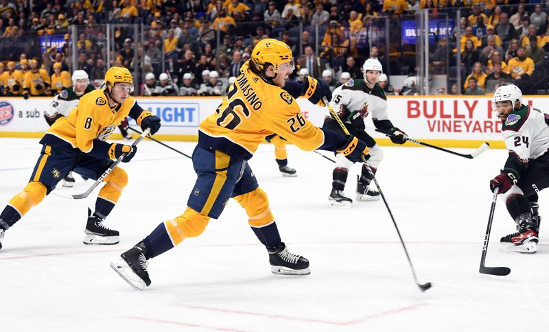 Nov 11, 2023; Nashville, Tennessee, USA; Nashville Predators center Philip Tomasino (26) shoots the puck during the first period against the Arizona Coyotes at Bridgestone Arena. Mandatory Credit: Christopher Hanewinckel-USA TODAY Sports