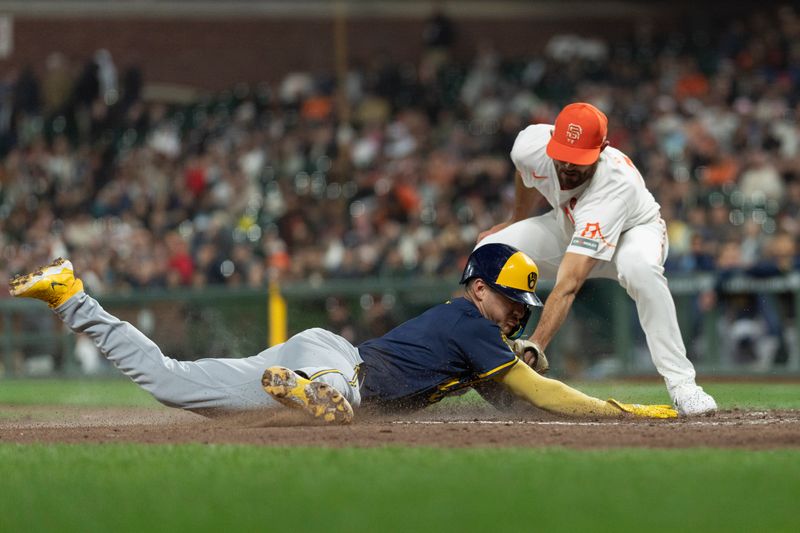 Sep 10, 2024; San Francisco, California, USA;  Milwaukee Brewers third base Joey Ortiz (3) dives towards home plate during the seventh inning against San Francisco Giants pitcher Tristan Beck (43) at Oracle Park. Mandatory Credit: Stan Szeto-Imagn Images