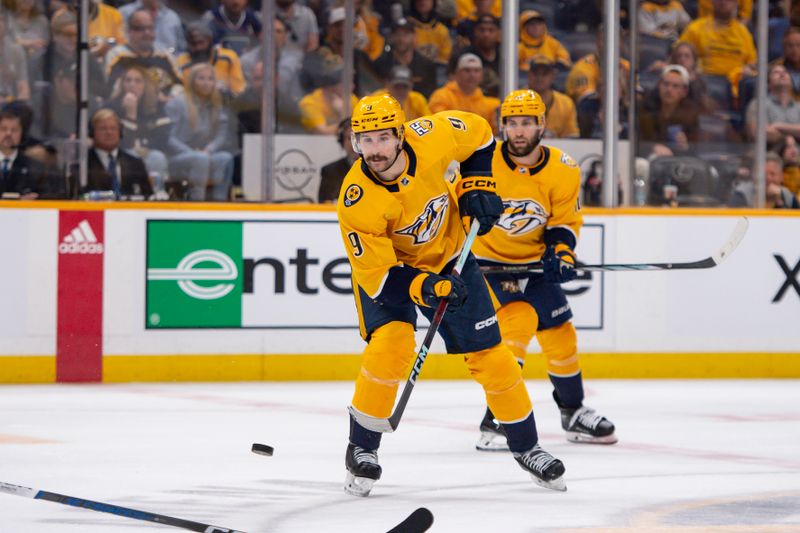 Apr 26, 2024; Nashville, Tennessee, USA; Nashville Predators left wing Filip Forsberg (9) passes the puck against the Vancouver Canucks during the third period in game three of the first round of the 2024 Stanley Cup Playoffs at Bridgestone Arena. Mandatory Credit: Steve Roberts-USA TODAY Sports