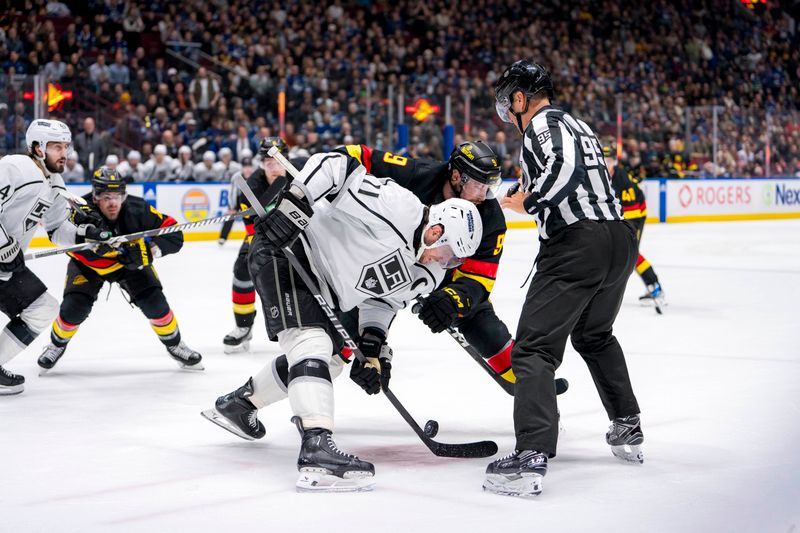 Mar 25, 2024; Vancouver, British Columbia, CAN; Los Angeles Kings forward Anze Kopitar (11) faces off against Vancouver Canucks forward J.T. Miller (9) in the third period at Rogers Arena. Kings won 3 -2. Mandatory Credit: Bob Frid-USA TODAY Sports