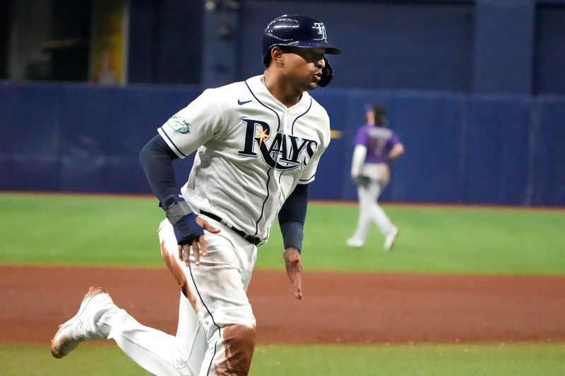 Aug 23, 2023; St. Petersburg, Florida, USA; Tampa Bay Rays catcher Christian Bethancourt (14) rounds third before scoring off of a single hit by first baseman Yandy Diaz (2) against the Colorado Rockies during the fifth inning at Tropicana Field. Mandatory Credit: Dave Nelson-USA TODAY Sports