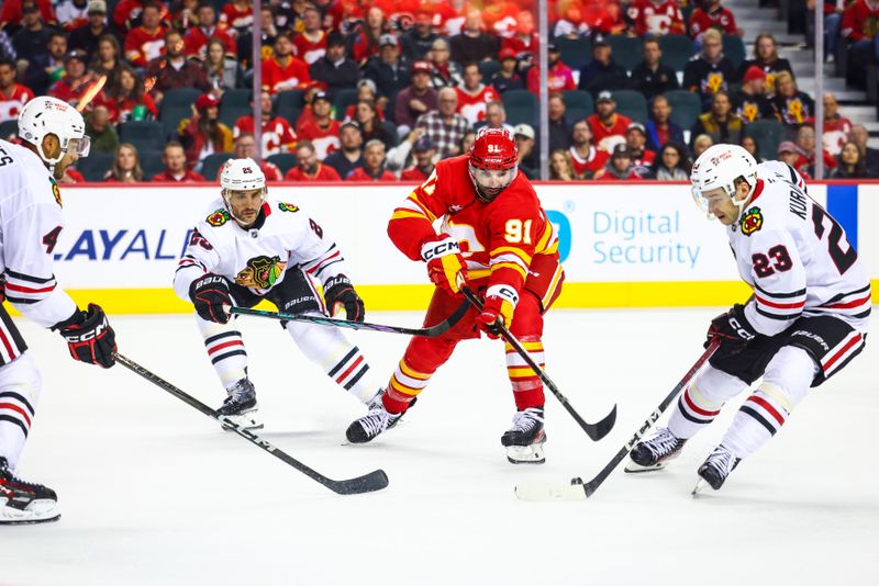 Oct 15, 2024; Calgary, Alberta, CAN; Calgary Flames center Nazem Kadri (91) controls the puck against the Chicago Blackhawks during the second period at Scotiabank Saddledome. Mandatory Credit: Sergei Belski-Imagn Images