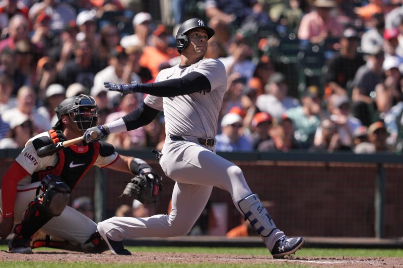 Jun 2, 2024; San Francisco, California, USA; New York Yankees right fielder Juan Soto (22) hits a home run against the San Francisco Giants during the ninth inning at Oracle Park. Mandatory Credit: Darren Yamashita-USA TODAY Sports