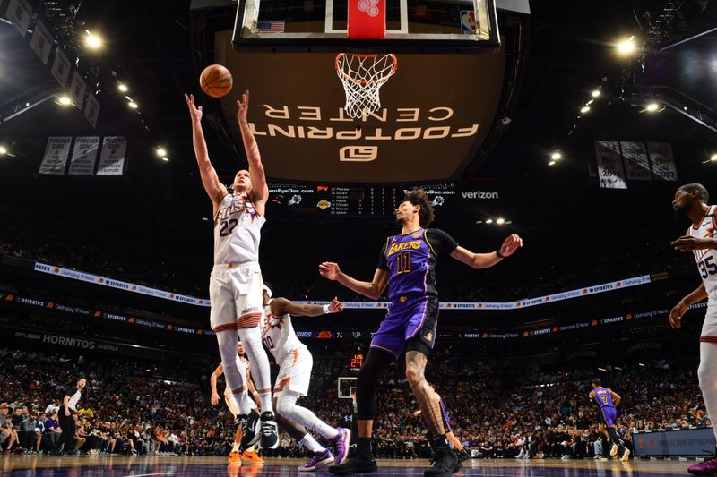 PHOENIX, AZ - OCTOBER 28: Mason Plumlee #22 of the Phoenix Suns goes up for the rebound during the game against the Los Angeles Lakers on October 28, 2024 at Footprint Center in Phoenix, Arizona. NOTE TO USER: User expressly acknowledges and agrees that, by downloading and or using this photograph, user is consenting to the terms and conditions of the Getty Images License Agreement. Mandatory Copyright Notice: Copyright 2024 NBAE (Photo by Barry Gossage/NBAE via Getty Images)