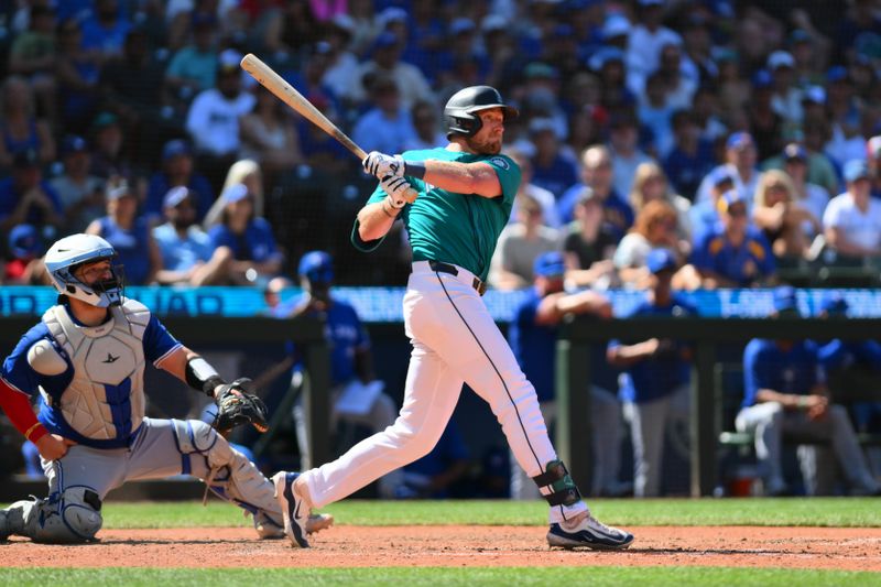 Jul 6, 2024; Seattle, Washington, USA; Seattle Mariners center fielder Luke Raley (20) hits a home run against the Toronto Blue Jays during the ninth inning at T-Mobile Park. Mandatory Credit: Steven Bisig-USA TODAY Sports