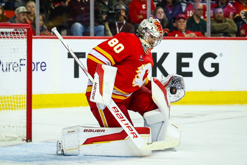 Dec 3, 2024; Calgary, Alberta, CAN; Calgary Flames goaltender Dan Vladar (80) makes a save against the Columbus Blue Jackets during the third period at Scotiabank Saddledome. Mandatory Credit: Sergei Belski-Imagn Images