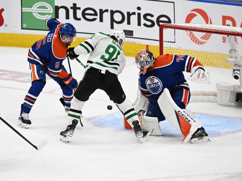 Jun 2, 2024; Edmonton, Alberta, CAN; Edmonton Oilers defenceman Cody Ceci (5) battles for the puck with the Dallas Stars centre Tyler Seguin (91) in front of  Oilers goalie Stuart Skinner (74) during the second period in game six of the Western Conference Final of the 2024 Stanley Cup Playoffs at Rogers Place. Mandatory Credit: Walter Tychnowicz-USA TODAY Sports