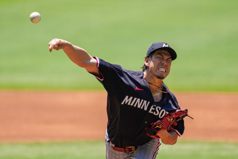 Jun 28, 2023; Cumberland, Georgia, USA; Minnesota Twins starting pitcher Kenta Maeda (18) pitches against the Atlanta Braves during the first inning at Truist Park. Mandatory Credit: Dale Zanine-USA TODAY Sports