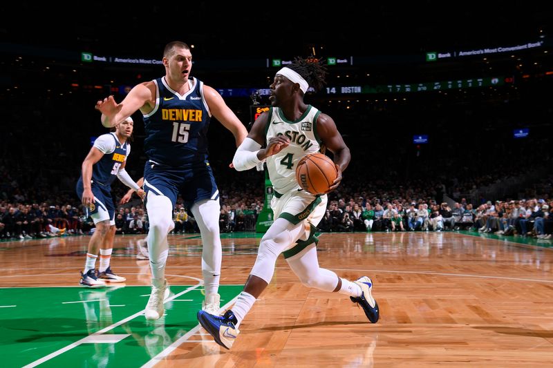 BOSTON, MA - JANUARY 19:  Jrue Holiday #4 of the Boston Celtics handles the ball during the game against the Denver Nuggets on January 19, 2024 at the TD Garden in Boston, Massachusetts. NOTE TO USER: User expressly acknowledges and agrees that, by downloading and or using this photograph, User is consenting to the terms and conditions of the Getty Images License Agreement. Mandatory Copyright Notice: Copyright 2024 NBAE  (Photo by Brian Babineau/NBAE via Getty Images)