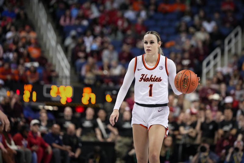 Mar 9, 2024; Greensboro, NC, USA; Virginia Tech Hokies guard Carleigh Wenzel (1) brings the ball up court in the first half against the Notre Dame Fighting Irish at Greensboro Coliseum. Mandatory Credit: David Yeazell-USA TODAY Sports