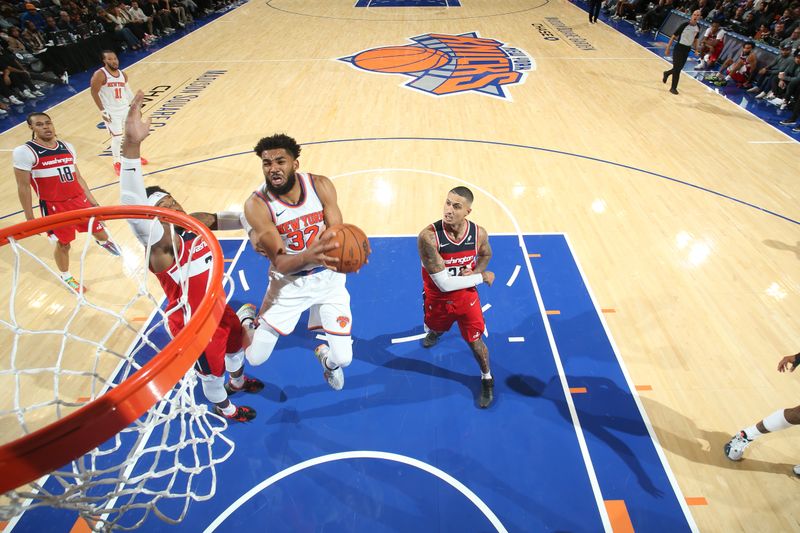 NEW YORK, NY - OCTOBER 9: Karl-Anthony Towns #32 of the New York Knicks drives to the basket during the game against the Washington Wizards during the 2024 NBA Preseason on October 9, 2024 at Madison Square Garden in New York City, New York.  NOTE TO USER: User expressly acknowledges and agrees that, by downloading and or using this photograph, User is consenting to the terms and conditions of the Getty Images License Agreement. Mandatory Copyright Notice: Copyright 2024 NBAE  (Photo by Nathaniel S. Butler/NBAE via Getty Images)