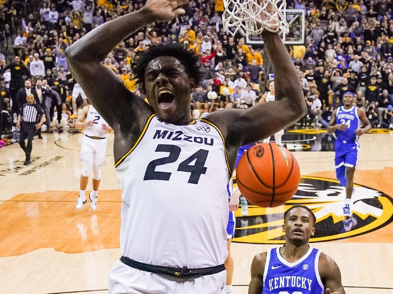 Dec 28, 2022; Columbia, Missouri, USA; Missouri Tigers guard Kobe Brown (24) dunks the ball as Kentucky Wildcats guard Cason Wallace (22) defends during the first half at Mizzou Arena. Mandatory Credit: Jay Biggerstaff-USA TODAY Sports