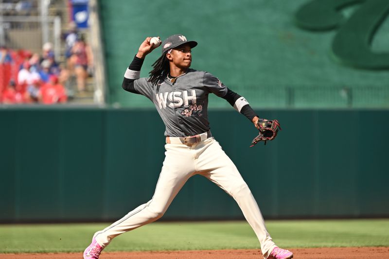 Aug 3, 2024; Washington, District of Columbia, USA; Washington Nationals shortstop CJ Abrams (5) throws to first base against the Milwaukee Brewers during the first inning at Nationals Park. Mandatory Credit: Rafael Suanes-USA TODAY Sports