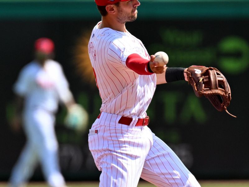 Mar 18, 2024; Clearwater, Florida, USA; Philadelphia Phillies shortstop Trea Turner (7) throws to first base in the first inning of the spring training game against the Pittsburgh Pirates  at BayCare Ballpark. Mandatory Credit: Jonathan Dyer-USA TODAY Sports