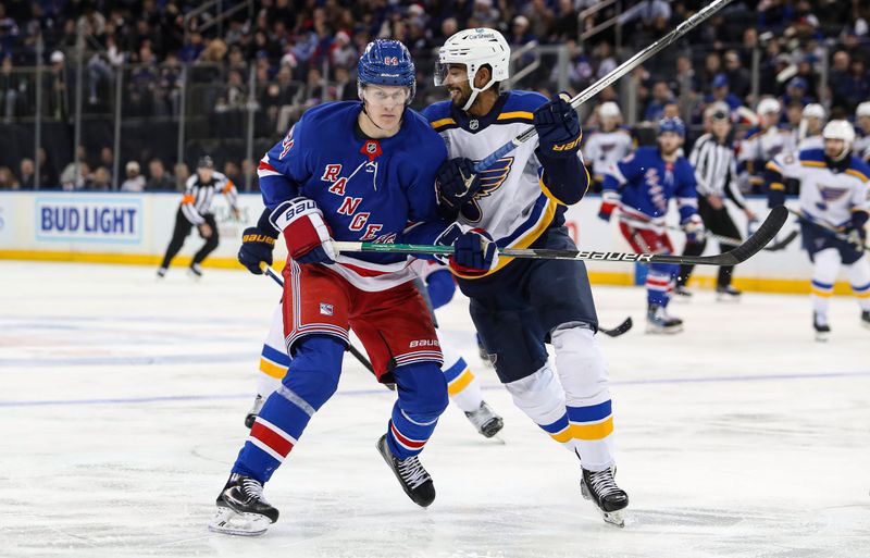 Nov 25, 2024; New York, New York, USA; New York Rangers center Adam Edstrom (84) and St. Louis Blues defenseman Pierre-Olivier Joseph (77) tangle in front of the net during the second period at Madison Square Garden. Mandatory Credit: Danny Wild-Imagn Images