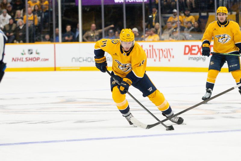 Nov 23, 2024; Nashville, Tennessee, USA;  Nashville Predators center Gustav Nyquist (14) skates with the puck against against the Winnipeg Jets during the first period at Bridgestone Arena. Mandatory Credit: Steve Roberts-Imagn Images