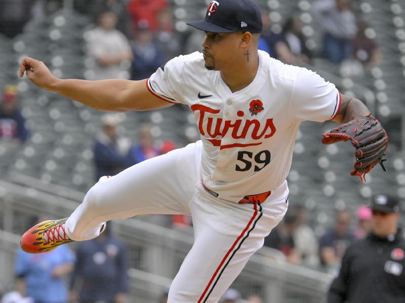 May 27, 2024; Minneapolis, Minnesota, USA; Minnesota Twins relief pitcher Jhoan Duran (59) delivers a pitch against the Kansas City Royals during the ninth inning at Target Field. Mandatory Credit: Nick Wosika-USA TODAY Sports