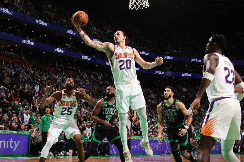 BOSTON, MA - FEBRUARY 3: Dario Saric #20 of the Phoenix Suns rebounds the ball during the game against the Boston Celtics on February 3, 2023 at TD Garden in Boston, Massachusetts.  NOTE TO USER: User expressly acknowledges and agrees that, by downloading and or using this photograph, User is consenting to the terms and conditions of the Getty Images License Agreement. Mandatory Copyright Notice: Copyright 2022 NBAE  (Photo by Nathaniel S. Butler/NBAE via Getty Images)