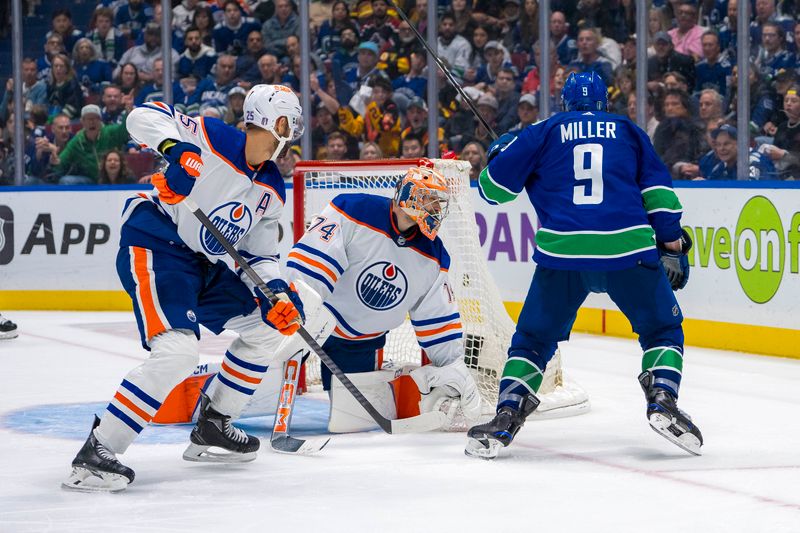 May 8, 2024; Vancouver, British Columbia, CAN; Edmonton Oilers defenseman Darnell Nurse (25) and goalie Stuart Skinner (74) react as Vancouver Canucks forward J.T. Miller (9) celebrates his goal during the third period in game one of the second round of the 2024 Stanley Cup Playoffs at Rogers Arena. Mandatory Credit: Bob Frid-USA TODAY Sports