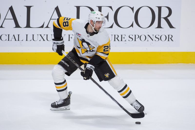 Dec 23, 2023; Ottawa, Ontario, CAN; Pittsburgh Penguins defenseman Marcus Pettersson (28) controls the puck in the third period against the  Ottawa Senators at the Canadian Tire Centre. Mandatory Credit: Marc DesRosiers-USA TODAY Sports