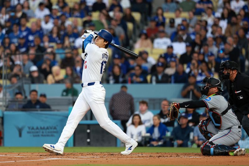 May 6, 2024; Los Angeles, California, USA;  Los Angeles Dodgers designated hitter Shohei Ohtani (17) hits a home run during the first inning against the Miami Marlins at Dodger Stadium. Mandatory Credit: Kiyoshi Mio-USA TODAY Sports