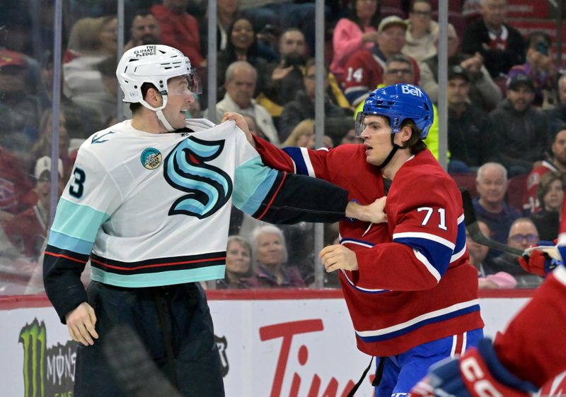 Oct 29, 2024; Montreal, Quebec, CAN; Seattle Kraken defenseman Will Borgen (3) and Montreal Canadiens forward Jake Evans (71) during the second period at the Bell Centre. Mandatory Credit: Eric Bolte-Imagn Images