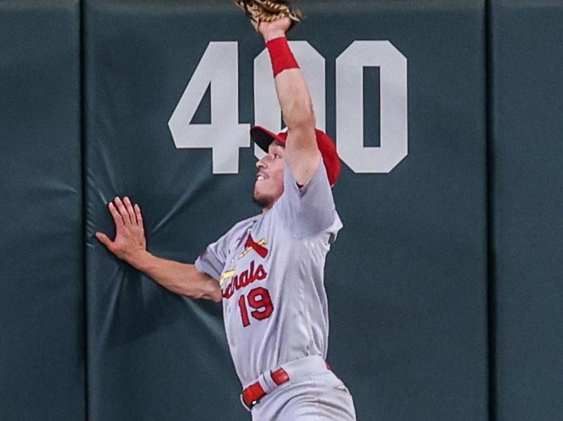 Sep 7, 2023; Atlanta, Georgia, USA; St. Louis Cardinals center fielder Tommy Edman (19) makes a leaping catch at the wall against the Atlanta Braves in the fifth inning at Truist Park. Mandatory Credit: Brett Davis-USA TODAY Sports