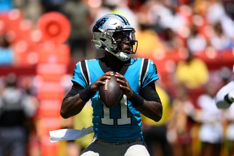 Carolina Panthers quarterback PJ Walker (11) in action during the first half of a preseason NFL football game against the Washington Commanders, Saturday, Aug. 13, 2022, in Landover, Md. (AP Photo/Nick Wass)