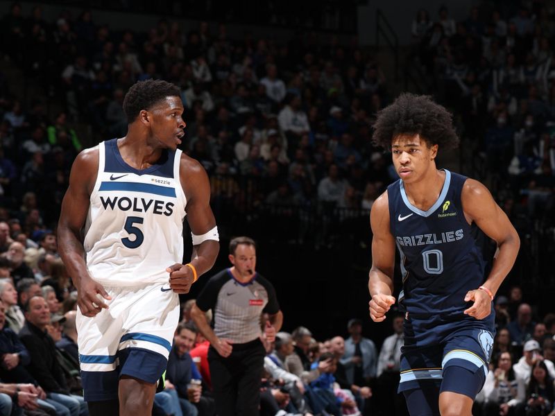 MINNEAPOLIS, MN -  JANUARY 11:  Anthony Edwards #5 of the Minnesota Timberwolves and Jaylen Wells #0 of the Memphis Grizzlies looks on during the game on January 11, 2025 at Target Center in Minneapolis, Minnesota. NOTE TO USER: User expressly acknowledges and agrees that, by downloading and or using this Photograph, user is consenting to the terms and conditions of the Getty Images License Agreement. Mandatory Copyright Notice: Copyright 2025 NBAE (Photo by David Sherman/NBAE via Getty Images)